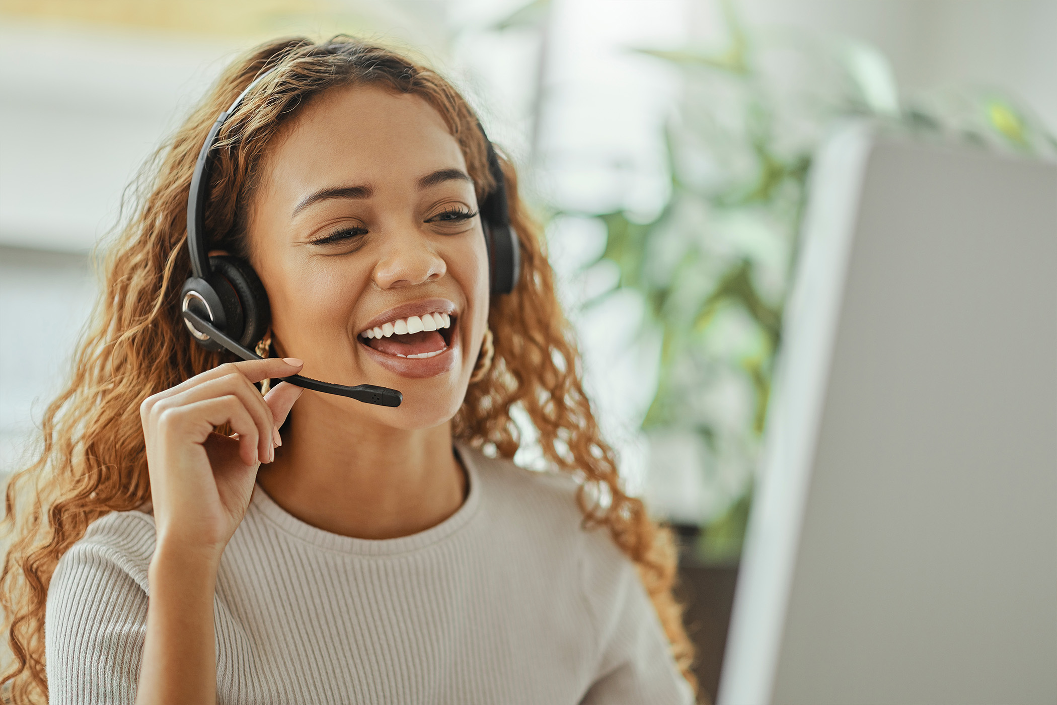 Helpline employee talking into headset