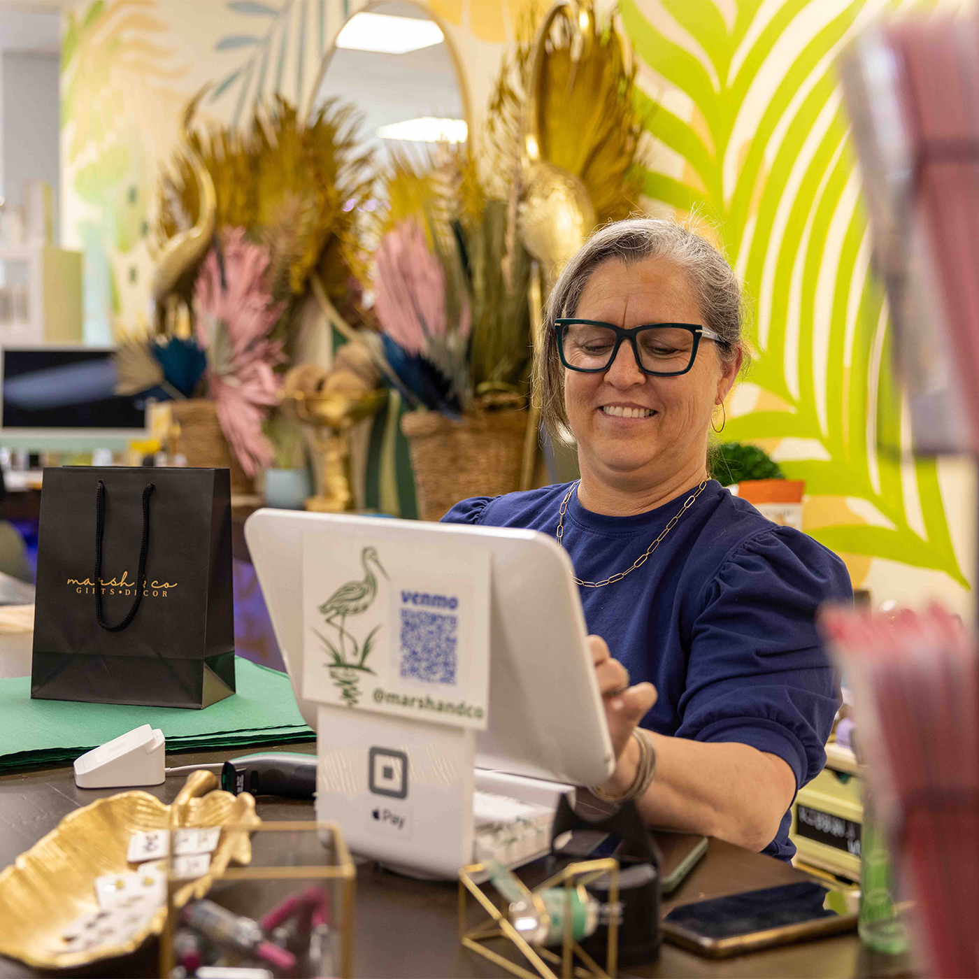 Store owner on tablet searching Business Internet Service Questions